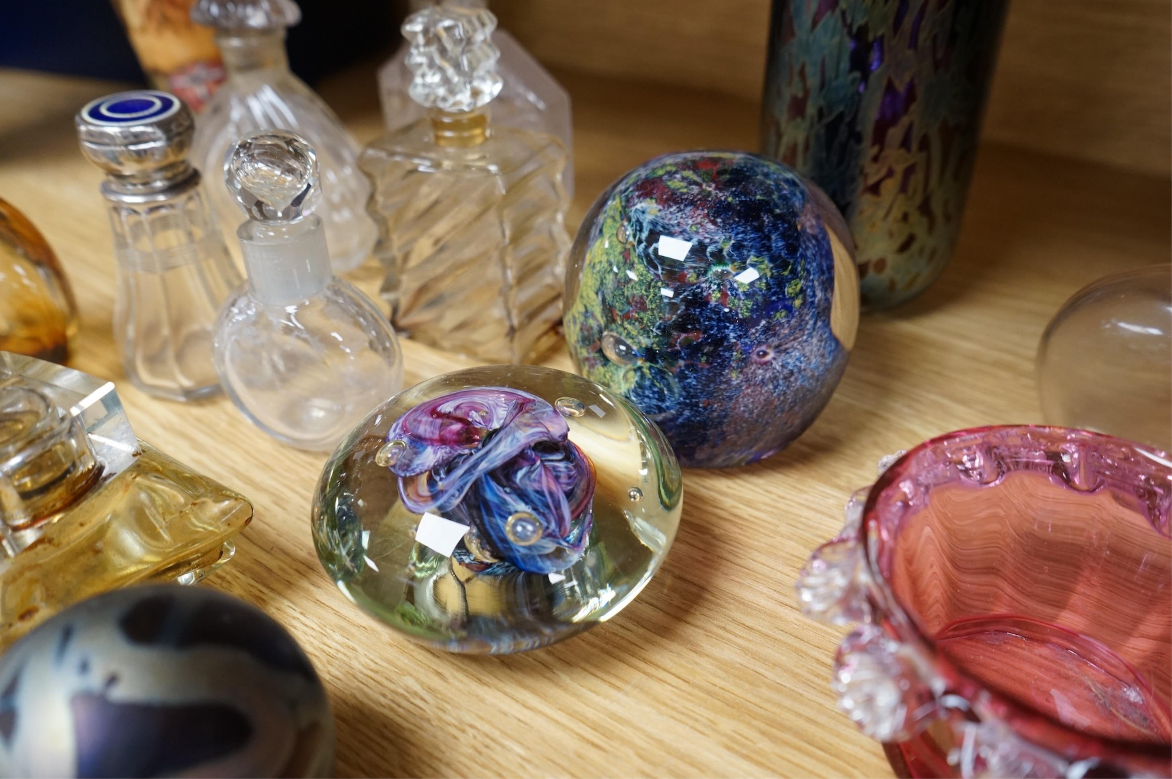 A collection of scent bottles, cranberry glass salts, three glass paperweights and a vase. tallest 18cm high